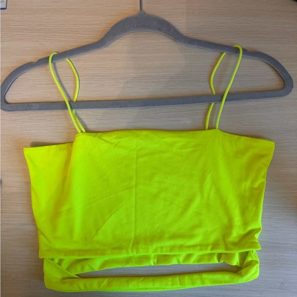 Neon green tank top with spaghetti straps and slit